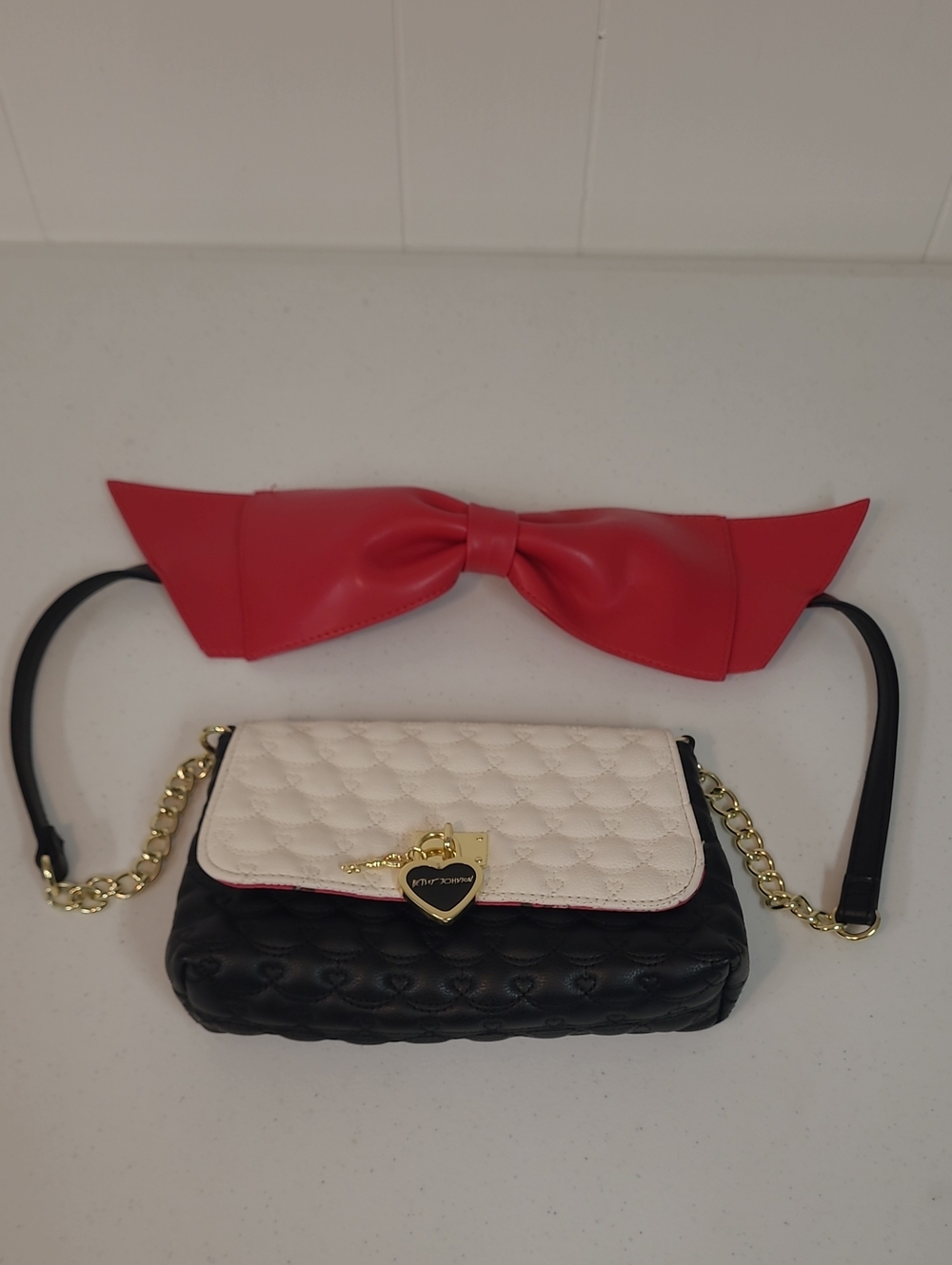 Betsey Johnson Black and White Quilted Crossbody Bag with Red Bow Shoulder Strap